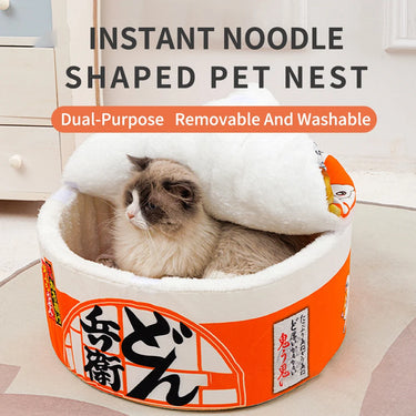 A cat enjoys the plush comfort of the Instant Noodles Cat Bed by KittyNook, featuring a removable and washable cover.